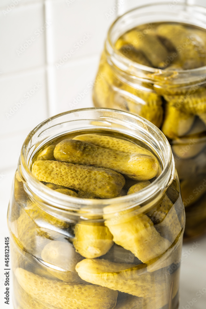 Small pickles. Marinated pickled cucumbers in jar. Small pickles. Marinated pickled cucumbers in jar.