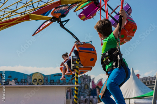 Little boy playing on a bungee trampoline