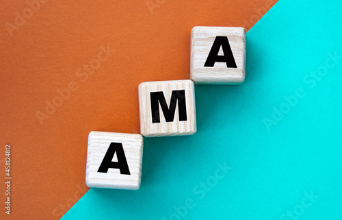 AMA - acronym on wooden cubes on a multi-colored background photo