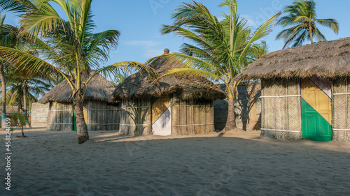 Bungalow with thatched roof and built in old tradition way on a beach in Ada Foah located at volta region Ghana West Africa photo