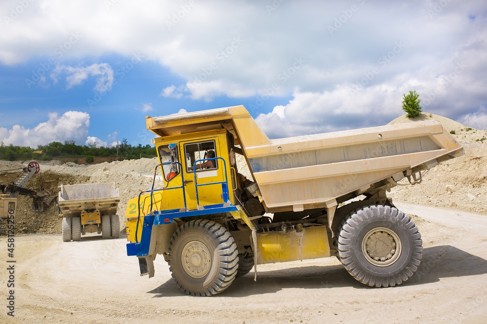 A large quarry dump truck loaded with rock. A large quarry dump truck loaded with rock.