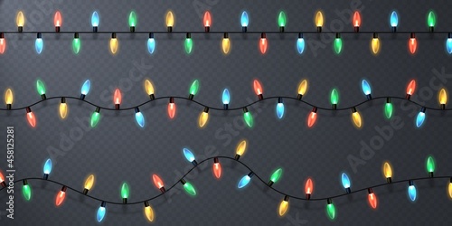 Christmas lights, isolated design elements. Holiday glowing lights. Colorful garland lights. Differently colored electric lights spaced evenly along a cable.