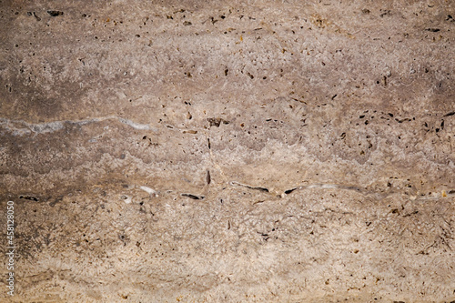 the texture of a stone wall with cracks
