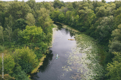 Kayak  canoe  hike across the densely thicket river  along the beautiful views of the river