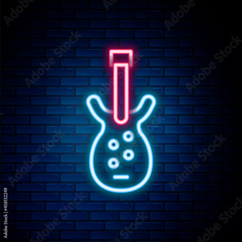 Glowing neon line Electric bass guitar icon isolated on brick wall background. Colorful outline concept. Vector