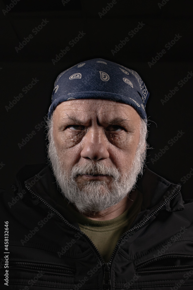 Portrait of an elderly man with a beard Portrait of an elderly man with a beard