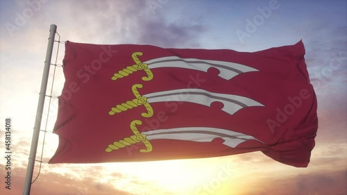 Essex flag, England, waving in the wind, sky and sun background photo