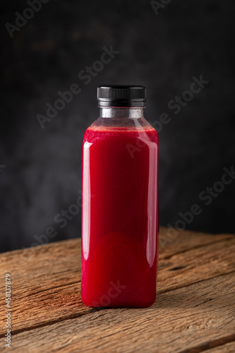 Red beet juice in plastic bottle.