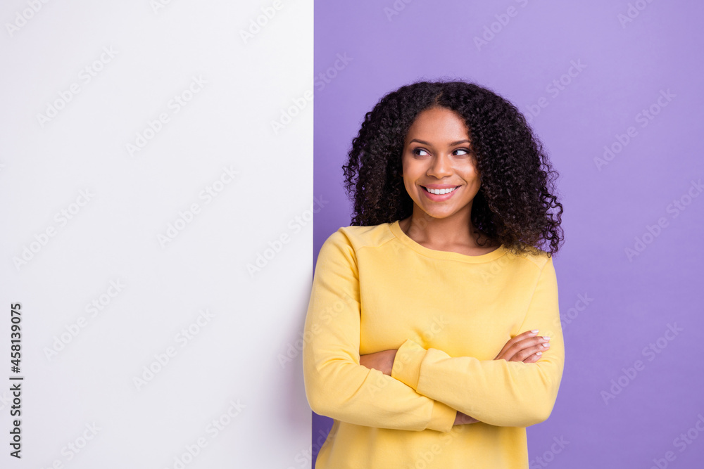 Portrait of young nice looking pretty smiling afro girl crossed hands look advertisement isolated on violet color background Portrait of young nice looking pretty smiling afro girl crossed hands look advertisement isolated on violet color background