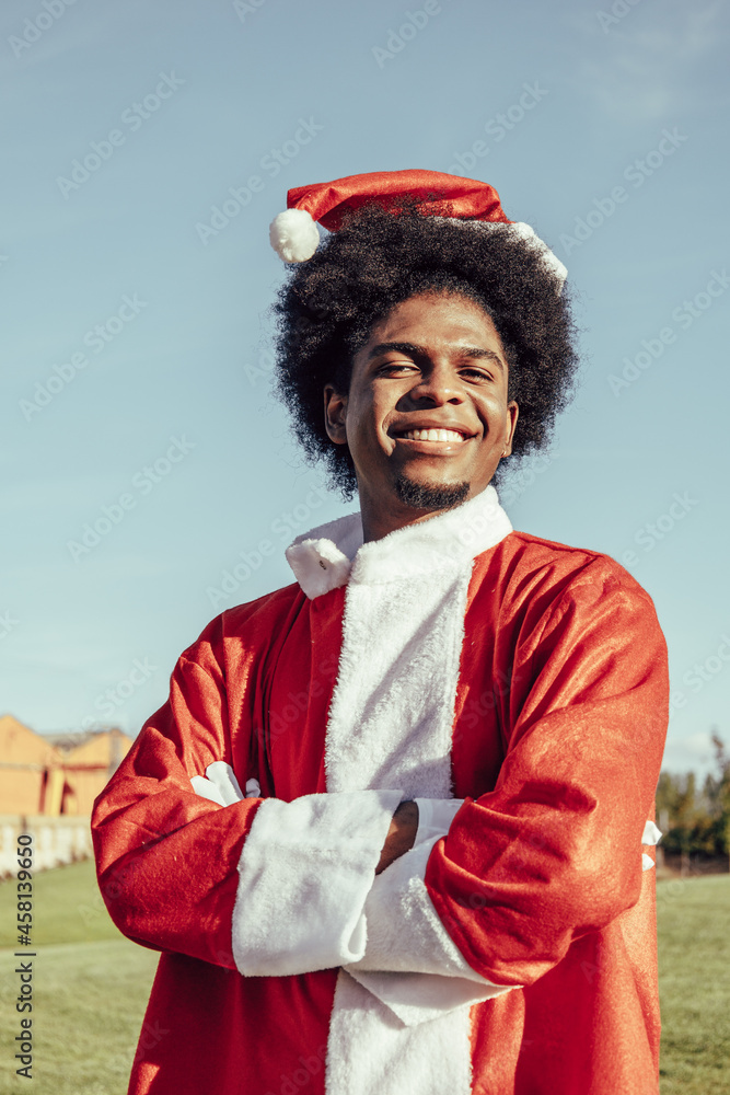 vertical portrait of black santa claus with afro hair outdoors vertical portrait of black santa claus with afro hair outdoors