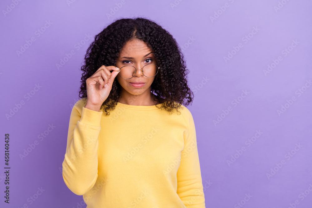 Fototapeta premium Photo of doubtful funny dark skin girl dressed yellow sweatshirt arm glasses looking you isolated purple color background