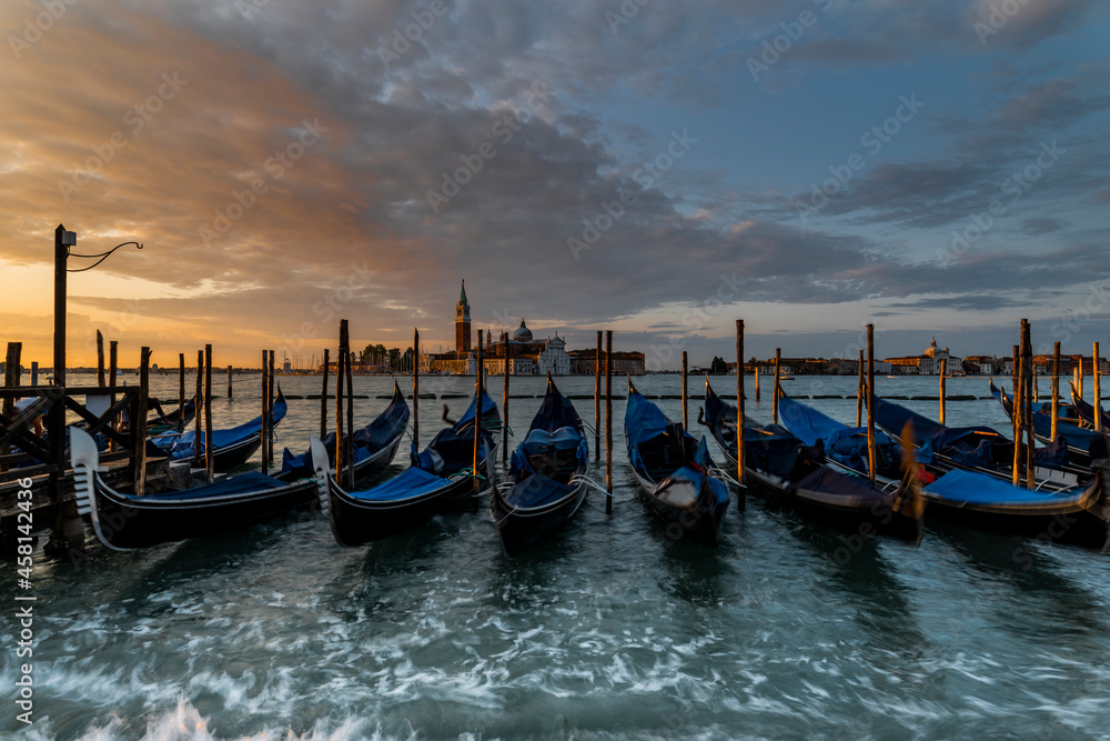Gondolas on the lagoon at Sunrise, Venice, Italy