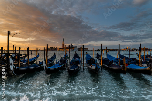 Gondolas on the lagoon at Sunrise, Venice, Italy © Tracey
