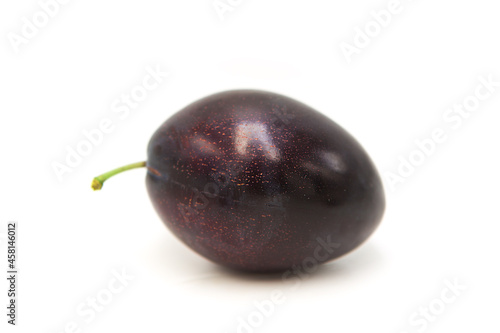 Ripe fresh organic plum isolated on white background.