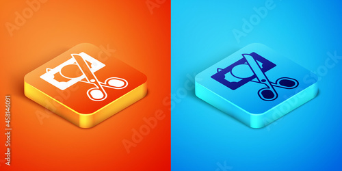 Isometric Scissors cutting money icon isolated on orange and blue background. Price, cost reduction or price reduction icon concept. Vector