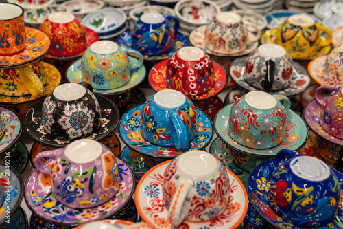 Ceramic cup and plates, Close-up view of handmade colorful Turkish ceramic cup and plates, colorful and harmonious