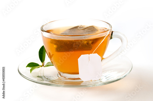 Cup of tea with leaves isolated on white background.