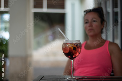 A young lady has been stood up by her date. Her posh gin and tonic remains untouched and her frustration shows as she realizes that the person she made arrangements with to meet isn't coming
