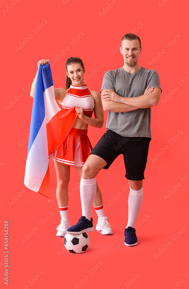 Cheerleader and football player with flag on color background Cheerleader and football player with flag on color background