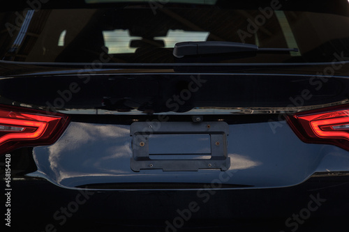 View of the trunk and taillights of the crossover in dark color 