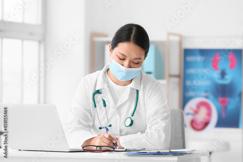 Female Asian doctor wearing...