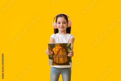 Smiling young girl wearing ...