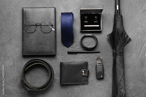 Set of male accessories on dark background