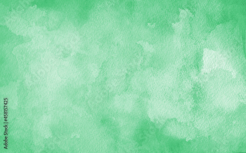 green watercolor background texture, blotches of watercolor paint, textured grainy paper, light mint green wash with abstract blob design