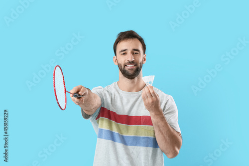 Sporty male badminton playe...
