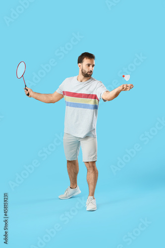 Sporty male badminton playe...