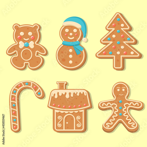 Set of Christmas gingerbread cookies. Chrismas candy, bear, snowman, gingerbread man, new year tree, house. Merry Christmas and Happy New Year figures cover by icing-sugar. 