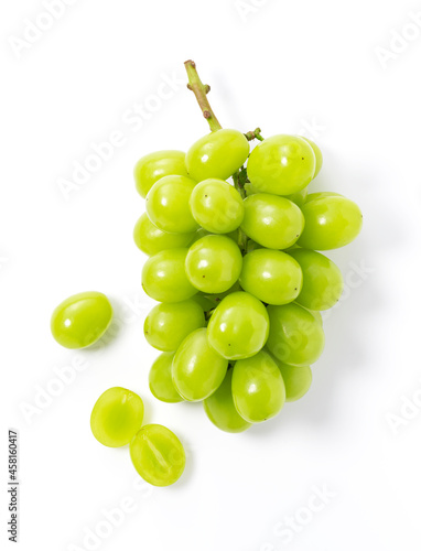 фотографія Bunches of Shine-Muscat grapes and cut Shine-Muscat grapes on a white background