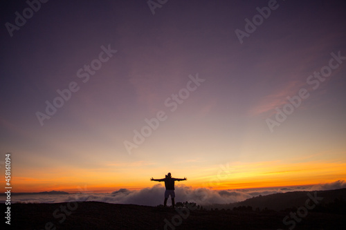 silhouette of a cross in the mountains © waldirsantos
