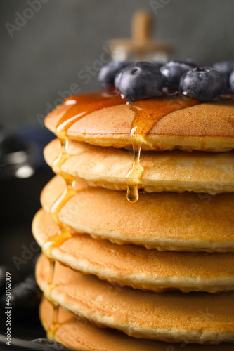 Tasty pancakes with honey a...