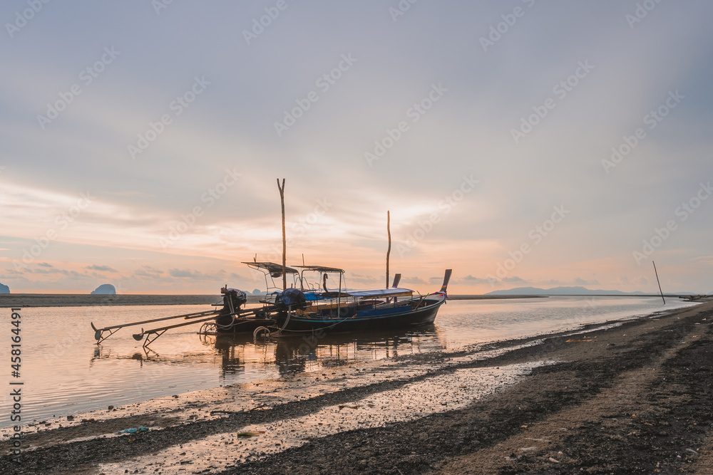 A fishing boats at fishing village on sunset time A fishing boats at fishing village on sunset time