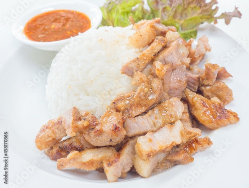 Grilled pork with rice and vegetables Served with spicy sauce