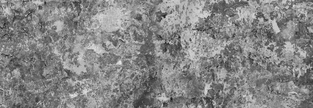 Fototapeta premium monochrome stucco wall with cracks and peeling paint flakes for overlay