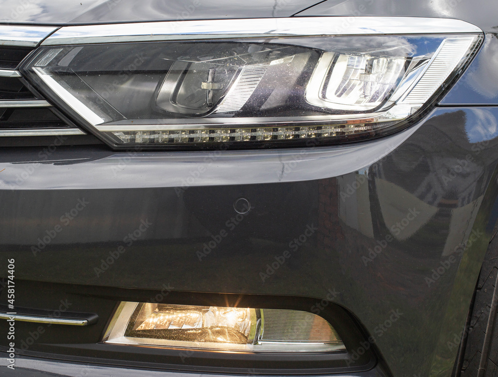 Economical and modern car headlight with LED adaptive light. Close-up, illuminate