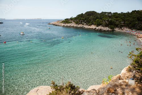 Fototapeta Naklejka Na Ścianę i Meble -  Beautiful beach with very clean and azure water on the mediterranean sea in the island of Ibiza, Spain