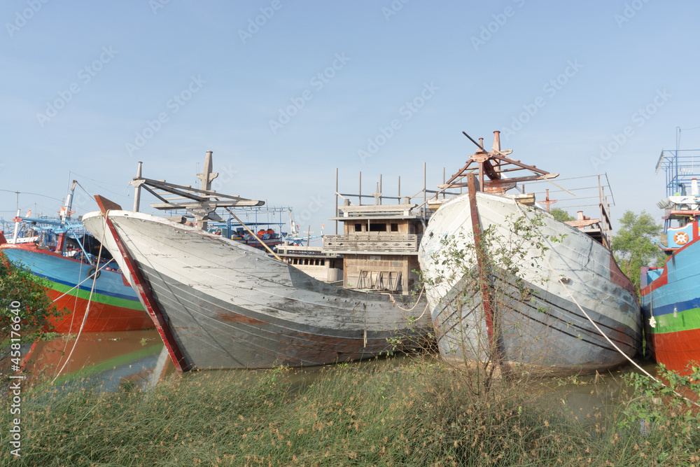 Landscape panoramic view of Commercial phishing boats, repair ship in dock
