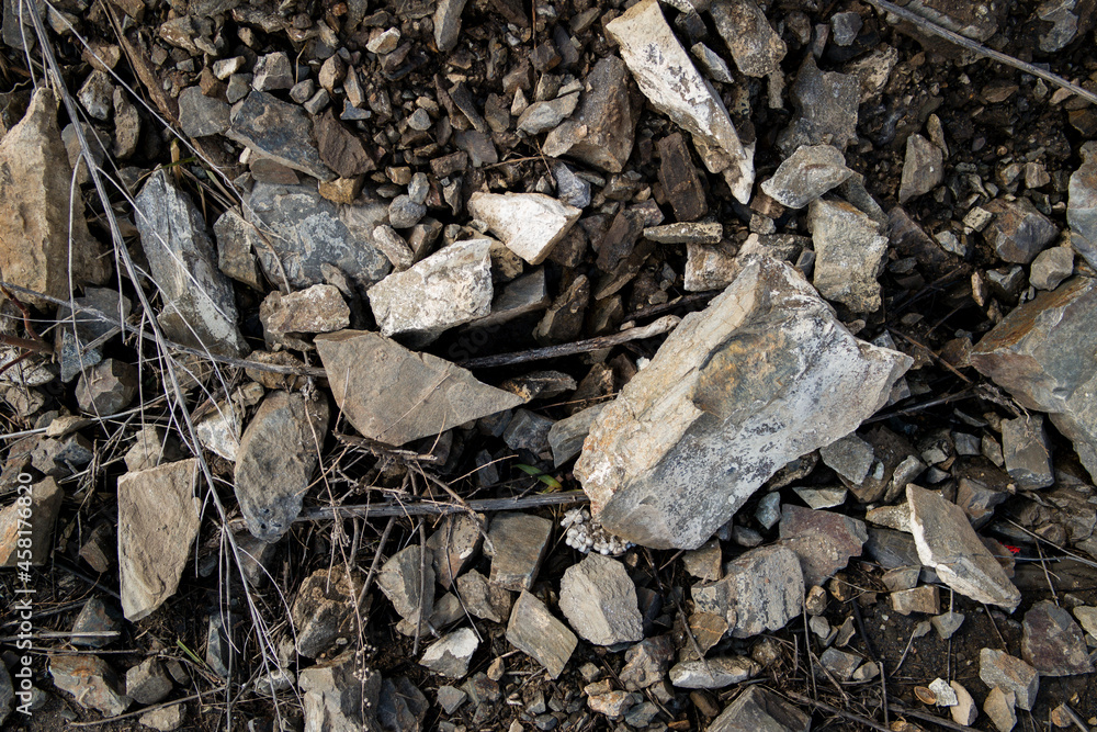 Crushed stone texture. Broken stones background. Dark grunge Crushed stone texture. Broken stones background. Dark grunge