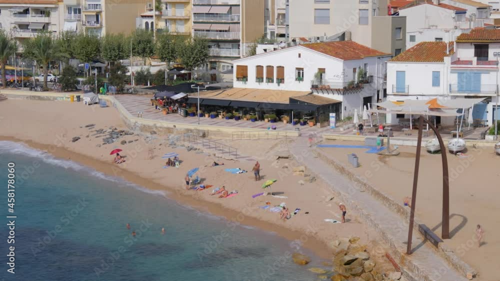 Timelapse on the Costa Brava of Girona Blanes Barcelona beach with people fast camera fixed shot turquoise blue sea Timelapse on the Costa Brava of Girona Blanes Barcelona beach with people fast camera fixed shot turquoise blue sea