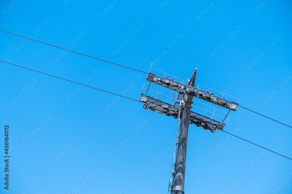 Ski lift. cable car poles. reels on pole. Aerial lift pylon. Ski lift. cable car poles. reels on pole. Aerial lift pylon.