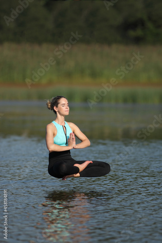 athletic young woman exercising outdoors