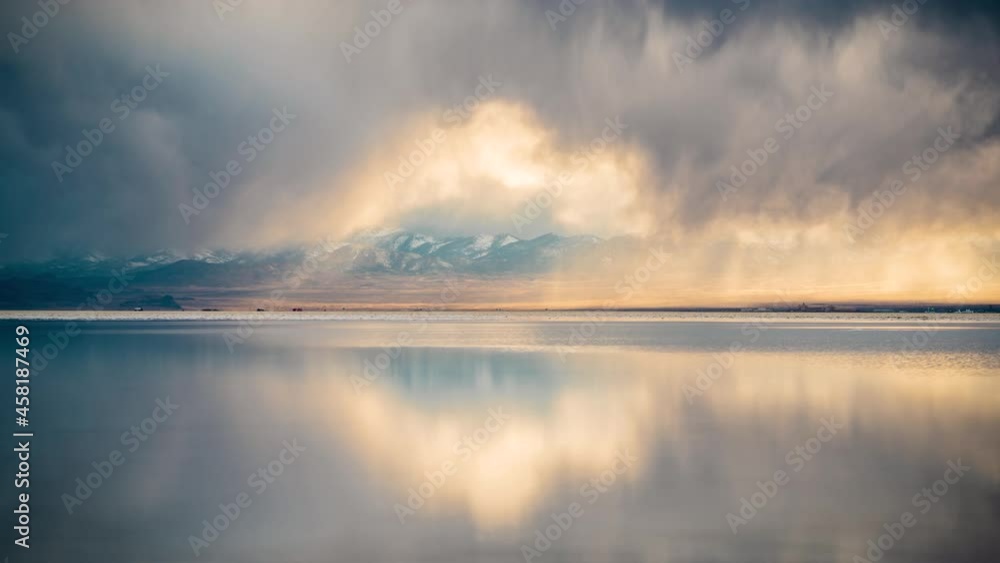 Time Lapse, Dark Clouds Moving Above Salt Flats With Mirror Reflection on Water. Bommeville Salt Flats, Utah USA Time Lapse, Dark Clouds Moving Above Salt Flats With Mirror Reflection on Water. Bommeville Salt Flats, Utah USA