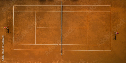 Tennis players on the court. Wide angle view from above with plenty of copyspace © lightpoet