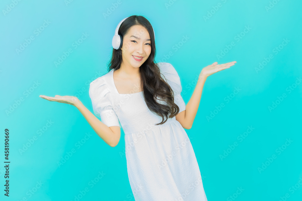 Portrait beautiful young asian woman with headphone and smart phone for listen music Portrait beautiful young asian woman with headphone and smart phone for listen music