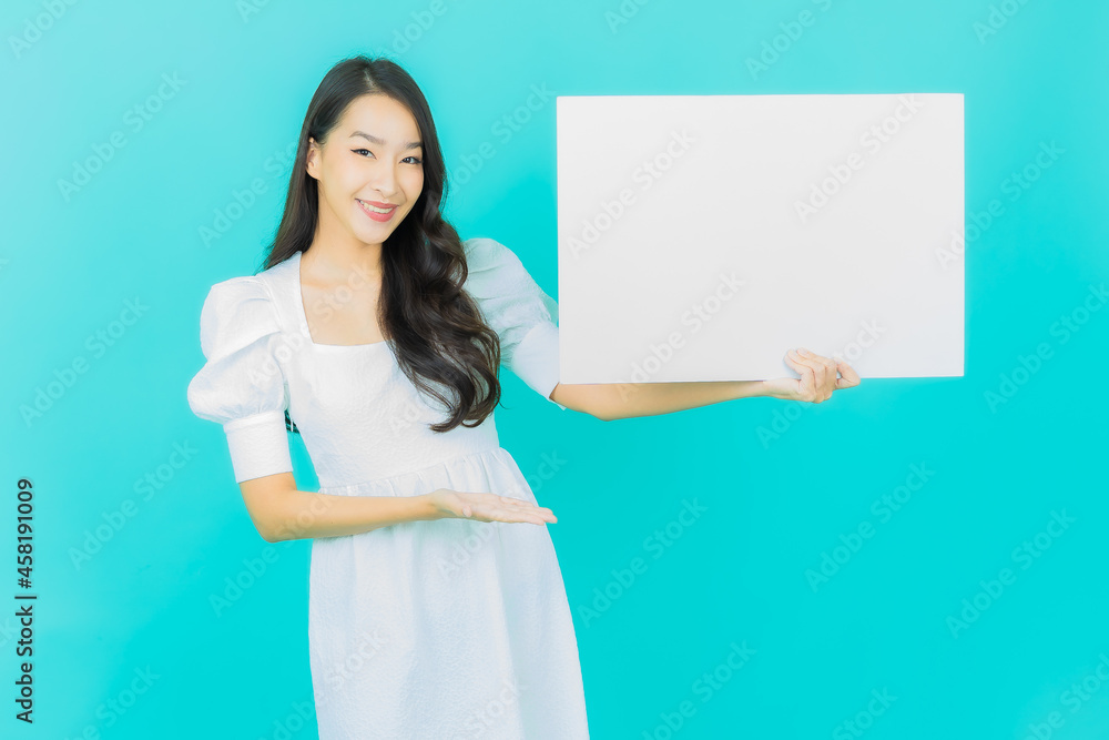 Portrait beautiful young asian woman with empty white billboard Portrait beautiful young asian woman with empty white billboard