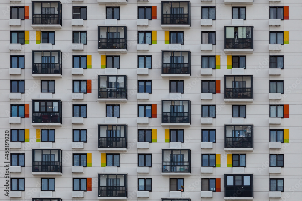 Background image - geometric pattern of balconies and windows of the building