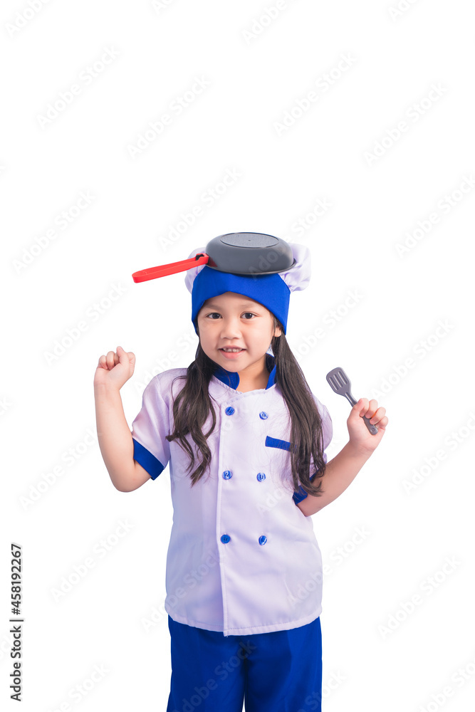 Happy girls with amazing smile in clothes and chef cap. child dreams of becoming a chef Happy girls with amazing smile in clothes and chef cap. child dreams of becoming a chef
